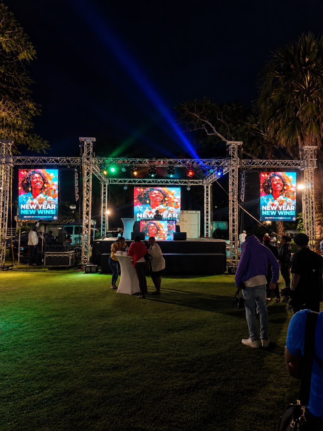 Outdoor stage with LED screens, truss, and show lighting